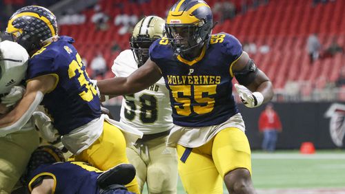 Prince Avenue Christian defensive lineman Christian Garrett pursues a Swainsboro runner during their 49-32 win  in the Class A Division I GHSA State Championship game at Mercedes-Benz Stadium, Monday, December. 11, 2023, in Atlanta. (Jason Getz / Jason.Getz@ajc.com)