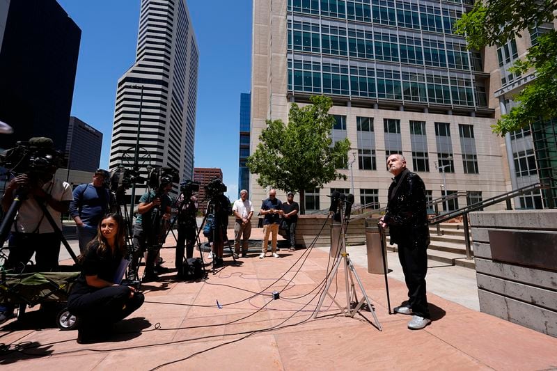 Ed Sanders, right, speaks after the sentencing of the shooter who killed five people and injured 19 others at an Colorado Springs, Colo., LGBTQ+ club at a hearing in federal court Tuesday, June 18, 2024, in Denver. The shooter pleaded guilty to federal hate crime charges and was sentenced to 55 life terms in prison. (AP Photo/David Zalubowski)