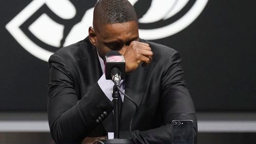 Toronto Raptors President Masai Ujiri is overcome with emotion speaking about Dikembe Mutombo, who died Monday from brain cancer, in Toronto, Monday, Sept. 30, 2024. (Chris Young/The Canadian Press via AP)