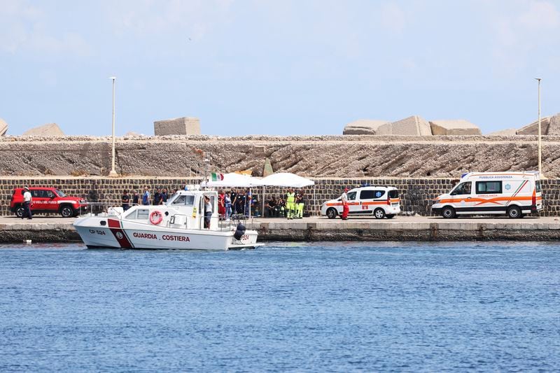 Emergency services at the scene of the search for a missing boat, in Porticello Santa Flavia, Italy, Monday, Aug. 19, 2024. British tech giant Mike Lynch, his lawyer and four other people are among those missing after their luxury superyacht sank during a freak storm off Sicily, Italy’s civil protection and authorities said. Lynch’s wife and 14 other people survived. (Alberto Lo Bianco /LaPresse via AP)