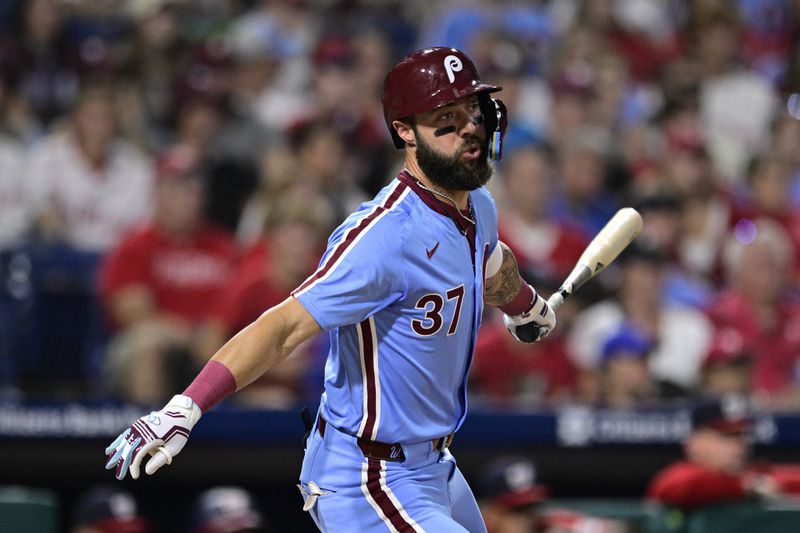 Philadelphia Phillies' Weston Wilson hits a double off Washington Nationals' Orlando Ribalta during the eighth inning of a baseball game, Thursday, Aug. 15, 2024, in Philadelphia. (AP Photo/Derik Hamilton)