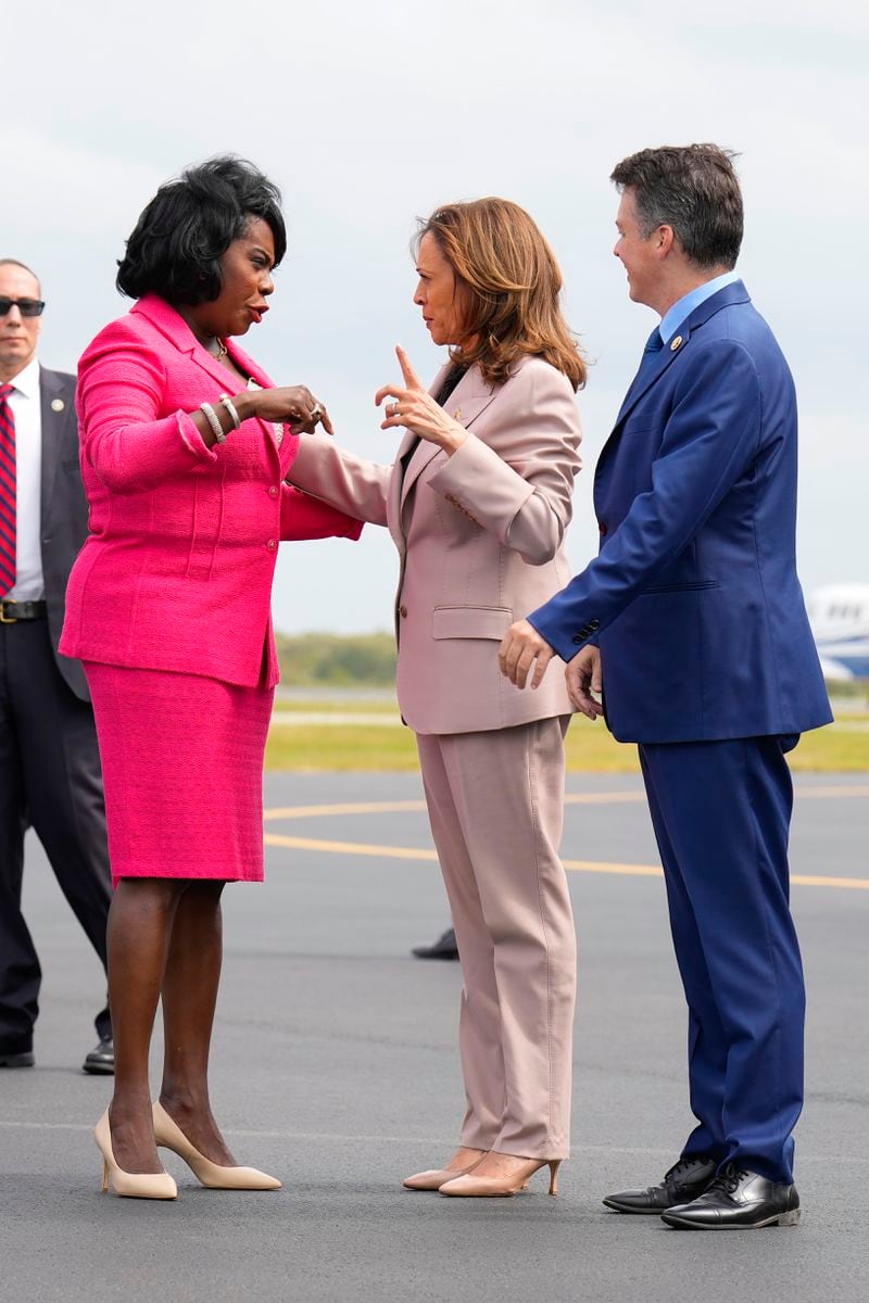 Democratic presidential nominee Vice President Kamala Harris, center, is greeted by Philadelphia Mayor Cherelle Lesley Parker, left, and Rep. Brendan Boyle, D-PA., right, on the tarmac at Atlantic Aviation Philadelphia, Monday, Sept. 9, 2024, near Philadelphia International Airport, in Philadelphia, Tuesday, Sept. 17, 2024. (AP Photo/Jacquelyn Martin)