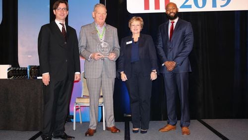 The Georgia Municipal Association presents a 2019 Live, Work, Play award to Duluth leaders at GMA’s annual Mayors’ Day Conference in Atlanta. (Courtesy City of Duluth)
