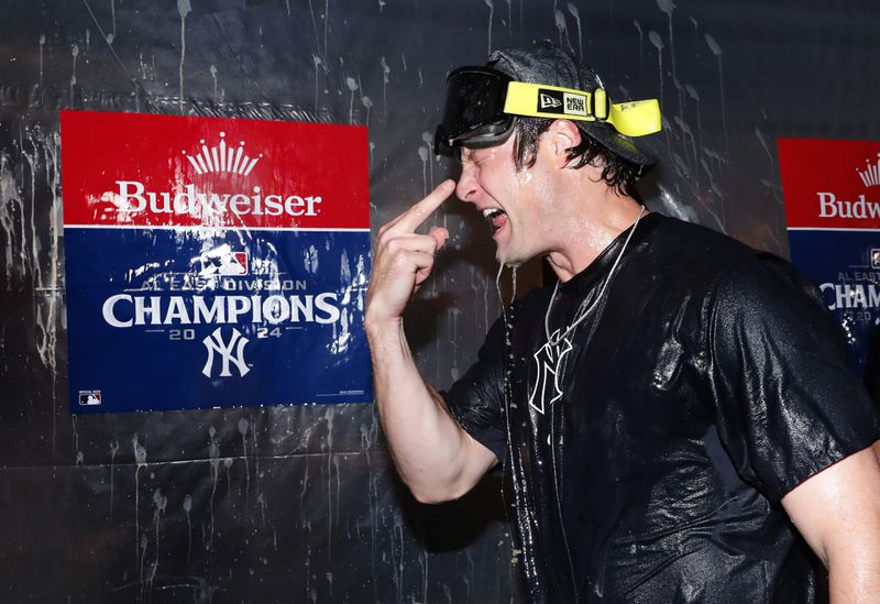 New York Yankees' Gerrit Cole celebrates with teammates after clinching the American League East title in a baseball game against Baltimore Orioles, Thursday, Sept. 26, 2024, in New York. (AP Photo/Noah K. Murray)