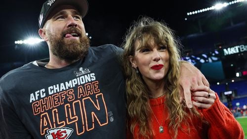 Kansas City Chiefs tight end Travis Kelce celebrates with his girlfriend, musician Taylor Swift, after defeating the Baltimore Ravens in the AFC Championship Game at M&T Bank Stadium on Jan. 28, 2024, in Baltimore. (Patrick Smith/Getty Images/TNS)