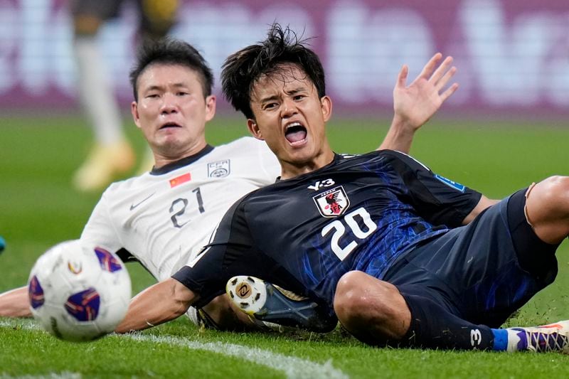 Japan's Takefusa Kubo and China's Li Yuanyi compete the ball during a World Cup and AFC Asian Qualifier between Japan and China at Saitama Stadium 2002 in Saitama, north of Tokyo, Thursday, Sept. 5, 2024.(AP Photo/Shuji Kajiyama)