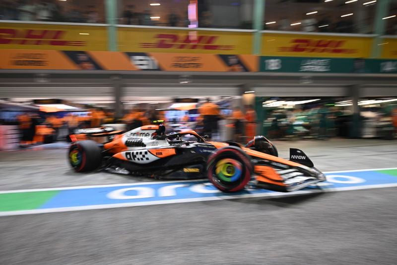 McLaren driver Lando Norris of Britain leaves the pit lane during the qualifying session of the Singapore Formula One Grand Prix at the Marina Bay Street Circuit, in Singapore, Saturday, Sept. 21, 2024. (Mohd Rasfan/Pool Photo via AP)