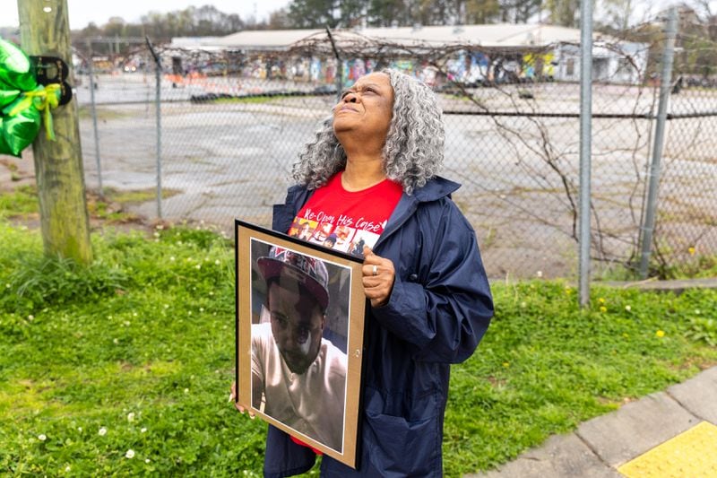 Kathy Scott-Lykes watches balloons float away after a balloon release ceremony for her son, Jarvis Lykes, in Atlanta on Friday, March 15, 2024. Arvin Temkar / arvin.temkar@ajc.com)