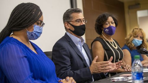 U.S. Department of Health and Human Services Secretary Xavier Becerra, center, visited Atlanta on Monday, as his office enters a standoff with Georgia Gov. Brian Kemp's administration over "waiver" proposals for Medicaid and the ACA marketplace.  Becerra is shown here at The Center for Black Women’s Wellness in Atlanta’s Mechanicsville community. (PHOTO by Alyssa Pointer / Atlanta Journal Constitution)