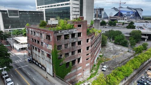 An aerial view of downtown Atlanta’s Constitution building shows it overrun with trees and greenery, resulting from years of neglect despite the city’s development efforts. This was observed on Wednesday, July 4, 2024.
(Miguel Martinez / AJC)