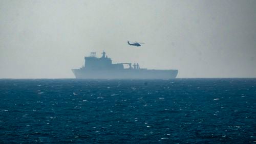 A ship is seen off the coast of Gaza near a U.S.-built floating pier, not seen, that is used to facilitate aid deliveries, as seen from the central Gaza Strip, Wednesday, July 10, 2024. (AP Photo/Abdel Kareem Hana)