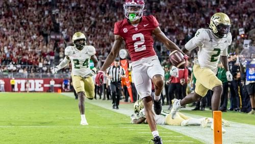 Alabama wide receiver Ryan Williams (2) scores a touchdown on a 43-yard pass reception against South Florida during the second half of an NCAA college football game, Saturday, Sept. 7, 2024, in Tuscaloosa, Ala. South Florida linebacker Mac Harris (24) and defensive back Tavin Ward (2) trail the play. (AP Photo/Vasha Hunt)