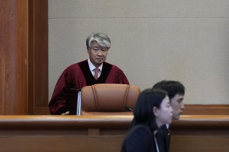 South Korea's Constitutional Court Chief Justice Lee Jong-seok arrives at the Constitutional Court in Seoul, South Korea, Thursday, Aug. 29, 2024. (AP Photo/Lee Jin-man)