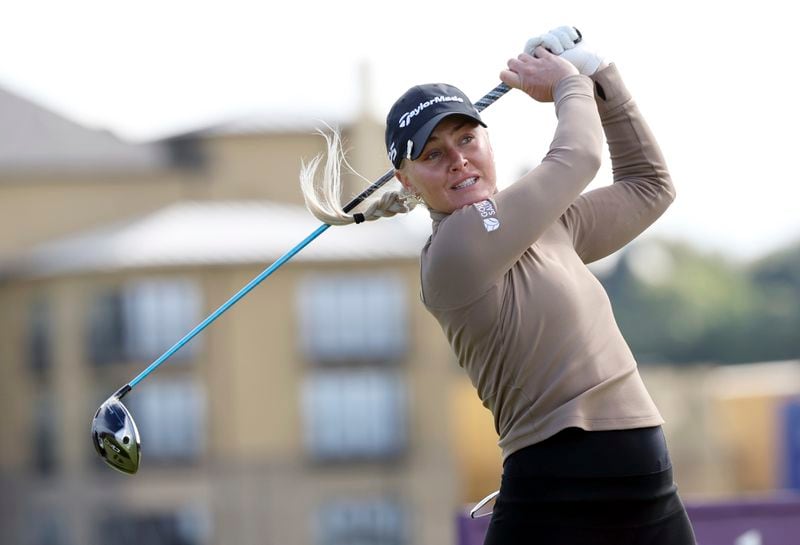 England's Charley Hull plays her shot at the 4th tee during the third round of the Women's British Open golf championship, in St Andrews, Scotland Saturday, Aug. 24, 2024. (AP Photo/Scott Heppell)