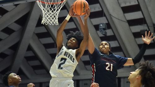 March 12, 2022 Macon - Norcross' London Johnson (2) and Berkmar's Malique Ewin (21) fight for a rebound during the 2022 GHSA State Basketball Class AAAAAAA Boys Championship game at the Macon Centreplex in Macon on Saturday, March 12, 2022. (Hyosub Shin / Hyosub.Shin@ajc.com)