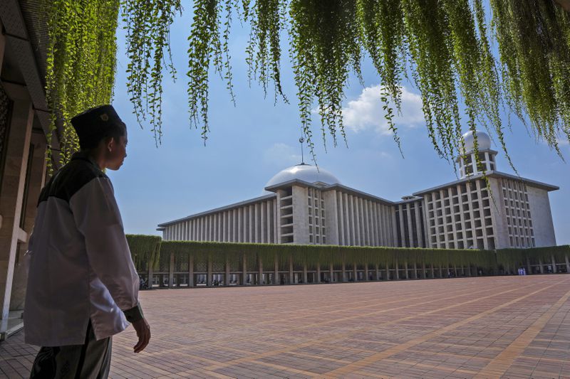 A man stands at Istiqlal Mosque in Jakarta, Indonesia, Friday, Aug. 9, 2024, where Pope Francis is scheduled to hold an interfaith meeting on Sept. 5. (AP Photo/Tatan Syuflana)