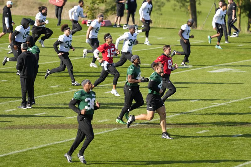 New York Jets quarterback Aaron Rodgers (8) participates in a training session in Ware, England, Friday, Oct. 4, 2024, ahead of the game between New York Jets and Minnesota Vikings at the Tottenham Hotspur stadium on Sunday. (AP Photo/Alastair Grant)