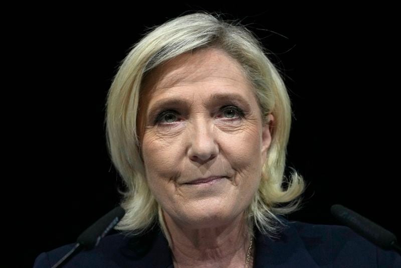 French far right leader Marine Le Pen looks on after delivering her speech after the release of projections based on the actual vote count in select constituencies , Sunday, June 30, 2024 in Henin-Beaumont, northern France. French voters propelled the far-right National Rally to a strong lead in first-round legislative elections Sunday and plunged the country into political uncertainty, according to polling projections. (AP Photo/Thibault Camus)