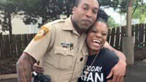 FILE - In this undated photo provided by Charlene Jefferson in August 2024, Travis Brown, when he was St. Louis County police officer, stands with Danielle Oliver. (Charlene Jefferson via AP, File)