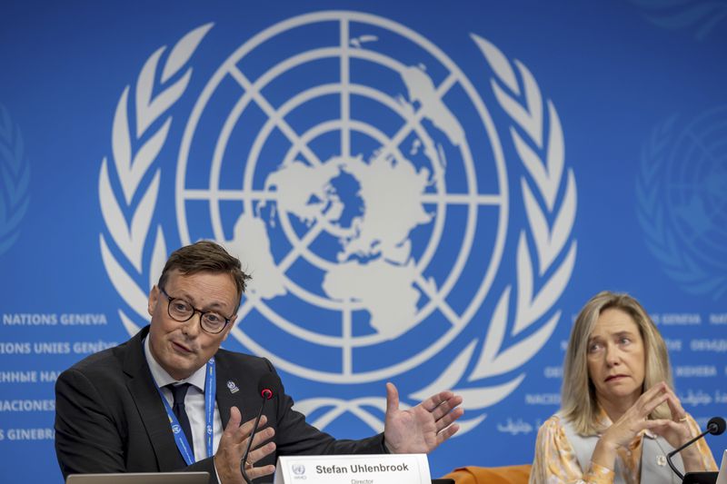 Stefan Uhlenbrook, left, director of Hydrology, Water and Cryosphere at the World Meteorological Organization (WMO), sits next to WMO Secretary-General Celeste Saulo as he presents the WMO's State of Global Water Resources report during a press conference at the European headquarters of the United Nations in Geneva, Switzerland, Monday, Oct. 7, 2024. (Salvatore Di Nolfi/Keystone via AP)