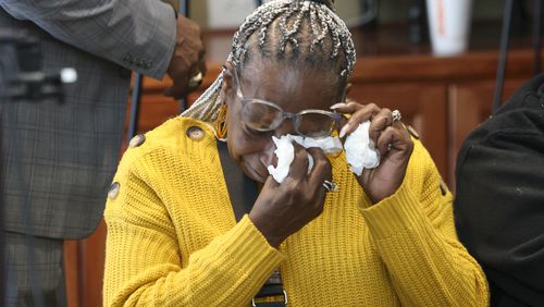 Chandra Toland reacts during a press conference for her late son Dino Walker, a Fulton inmate, who was stabbed to death at the Fulton County Jail in 2022 at the office of Davis Bozeman Johnson Law, Thursday, September 21, 2023, in Decatur, Ga. (Jason Getz / Jason.Getz@ajc.com)