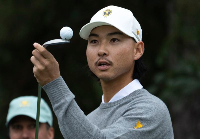 International team player Min Woo Lee, from Australia, keep his eyes on a ball as he waits to tee off during a practice session for the Presidents Cup golf tournament at Royal Montreal Golf Club in Montreal, Wednesday, Sept. 25, 2024. (Ryan Remiorz/The Canadian Press via AP)