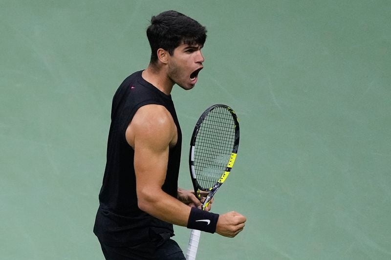 Carlos Alcaraz, of Spain, reacts after scoring a point against Botic van De Zandschulp, of the Netherlands, during the second round of the U.S. Open tennis championships, Thursday, Aug. 29, 2024, in New York. (AP Photo/Matt Rourke)