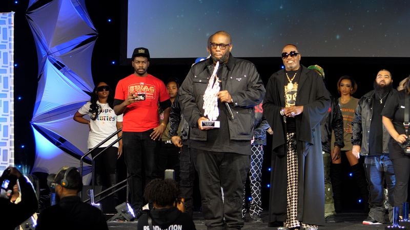 Atlanta rapper and activist Killer Mike accepts a Lifetime Achievement Award from curator Glynn Jackson at the 2024 Bronner Bros. International Beauty Show in February. Photo provided by Flip Sterling