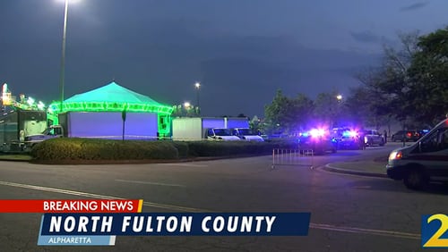 Alpharetta police shut down the North Point Mall Carnival on Wednesday night after two teenage girls were injured by what was believed to be accidental gunfire. A suspect has been arrested, police said Friday.