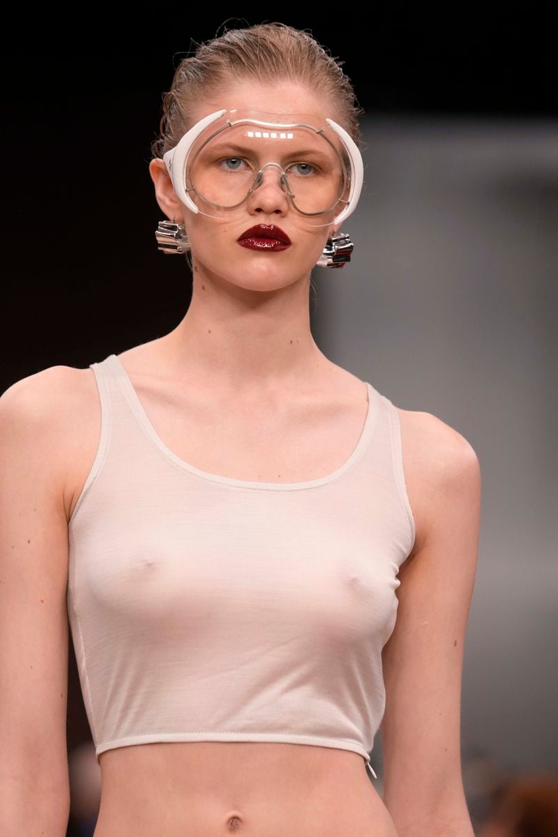 A model wears a creation as part of the Ferrari Spring Summer 2025 collection, that was presented in Milan, Italy, Saturday, Sept. 21, 2024. (AP Photo/Luca Bruno).