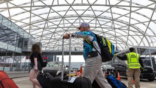 Travelers are seen at the domestic terminal of Hartsfield-Jackson International Airport in Atlanta on Friday, June 30, 2023. (Arvin Temkar / arvin.temkar@ajc.com)