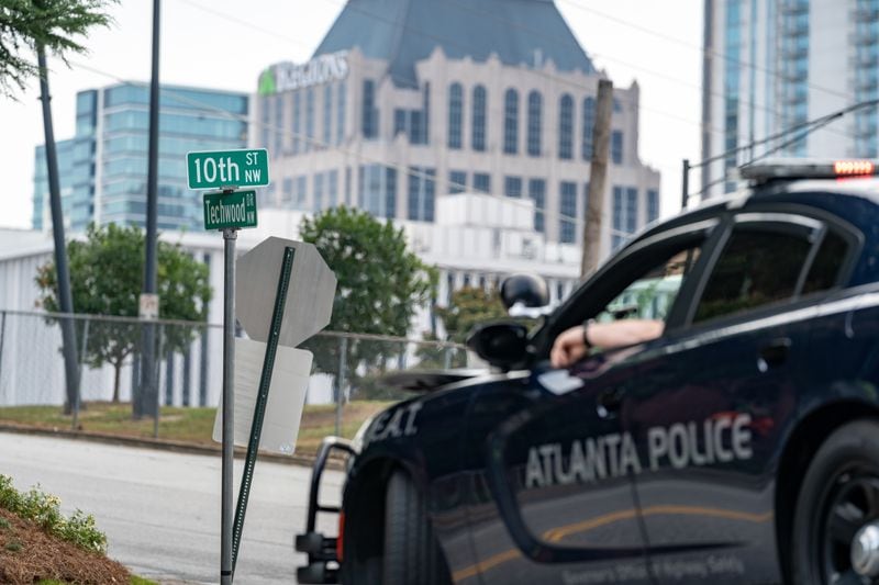An Atlanta Police car blocks the road at 10th and Techwood Drive on Thursday, June 27, 2024 (Ben Hendren for the Atlanta Journal-Constitution)