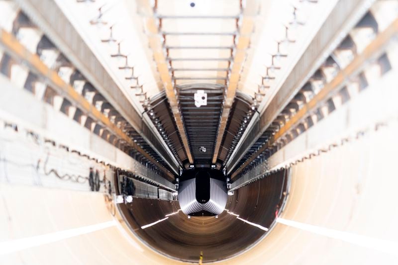 A test vehicle levitated by magnetic fields zips through a depressurized tube in a testing ground for a high-speed transit system during a press tour of a European test center for hyperloop transportation technology in Veendam, northern Netherlands, Friday, Sept. 6, 2024. (AP Photo/Peter Dejong)