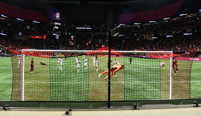 Chicago goalkeeper Bobby Shuttleworth (1) is not able to stop the goal by Atlanta United midfielder Ezequiel Barco (8) during the first half Saturday, April 24, 2021, at Mercedes-Benz Stadium in Atlanta. (Hyosub Shin / Hyosub.Shin@ajc.com)