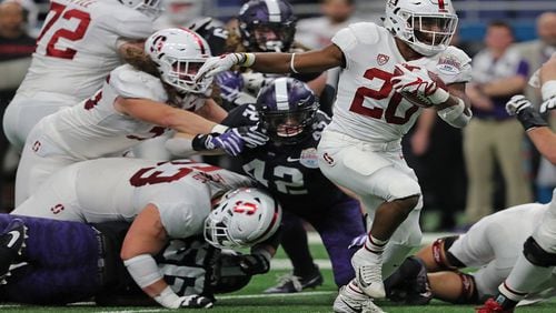 Stanford running back Bryce Love (20) carries on a 15-yard touchdown run against Texas Christian in the Valero Alamo Bowl at the Alamodome in San Antonio, Texas, on December 28, 2017. (Rodger Mallison/Fort Worth Star-Telegram/TNS)