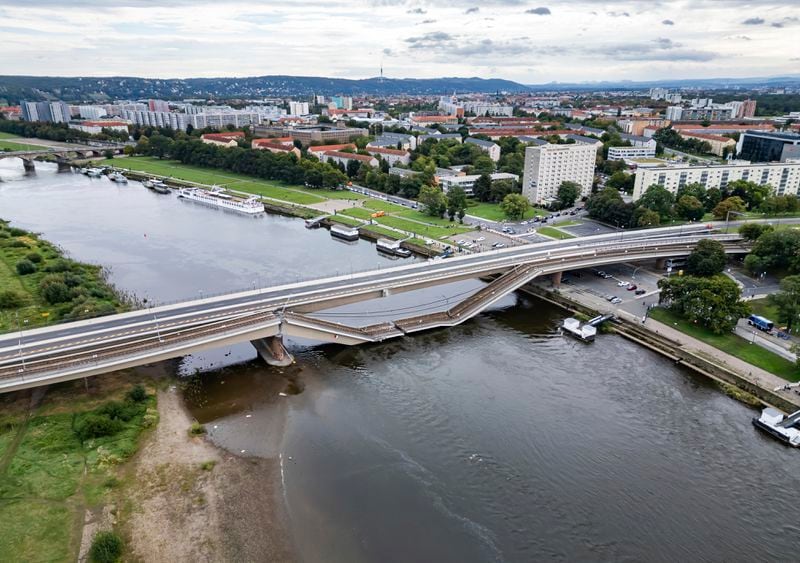 Parts of the Carola Bridge over the Elbe have collapsed in Dresden, Germany, Wednesday, Sept. 11, 2024. (Robert Michael/dpa via AP)