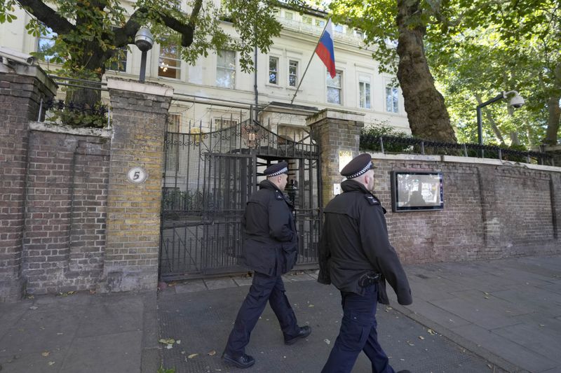 Police officers guard the entrance of the Russian Embassy in London, Friday, Sept. 13, 2024. (AP Photo/Frank Augstein)