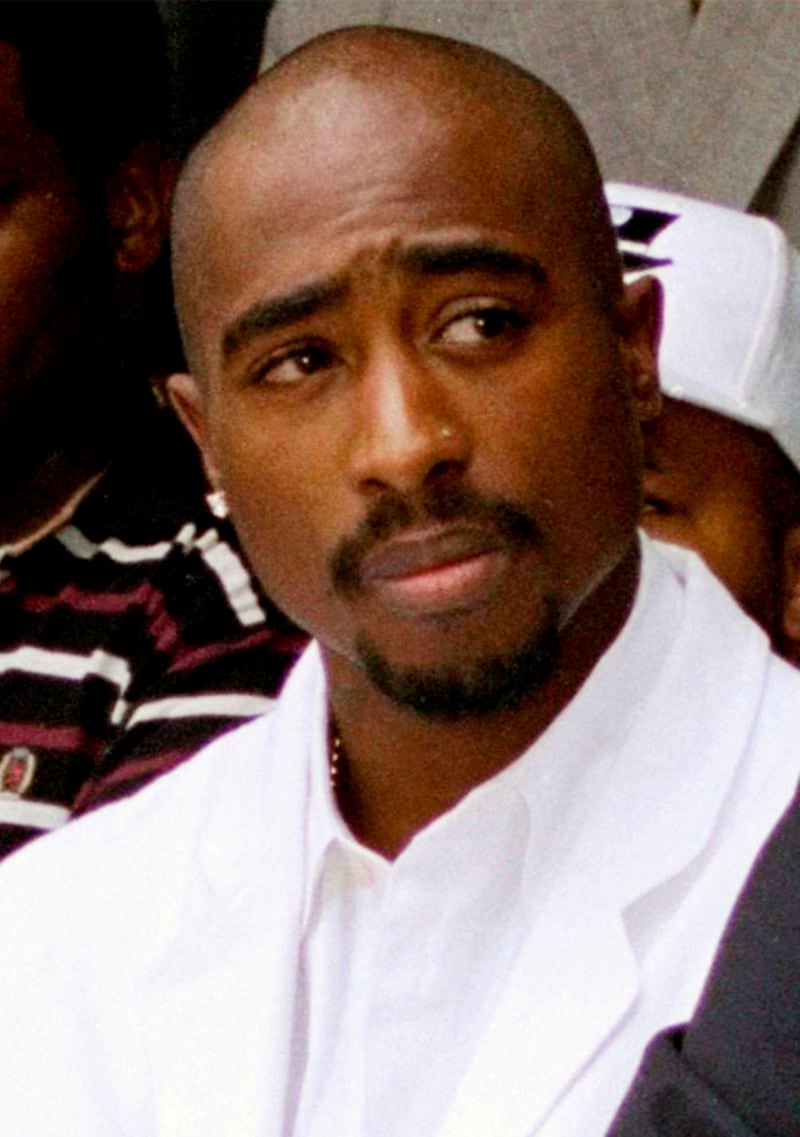 FILE - Rapper Tupac Shakur attends a voter registration event in South Central Los Angeles, Aug. 15, 1996. A Nevada judge is being asked to decide Tuesday, June 25, 2024, if a former Los Angeles-area gang leader will be freed from jail to house arrest ahead of his murder trial in the 1996 killing of hip-hop music legend Tupac Shakur. (AP Photo/Frank Wiese, File)