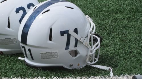 Fellowship Christian Paladins helmets rest on the field at Barron Stadium in Rome on Aug. 19, 2022 during the 31st annual Corky Kell Classic. (Adam Krohn/for the AJC)