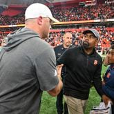 Georgia Tech coach Brent Key, left, congratulates Syracuse coach Fran Brown after a game Saturday, Sept. 7, 2024 in Syracuse, N.Y. Syracuse won 31-28. (AP Photo/Hans Pennink)