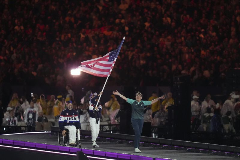 Members of the United States delegation parade during the closing ceremony of the 2024 Paralympics, Sunday, Sept. 8, 2024, in Paris, France. (AP Photo/Thibault Camus)