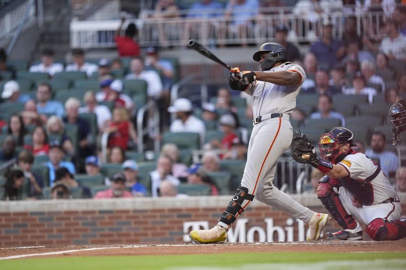 San Francisco Giants' Jorge Soler (2) hits a solo home run in the fifth inning of a baseball game against the Atlanta Braves, Tuesday, July 2, 2024, in Atlanta. (AP Photo/Brynn Anderson)