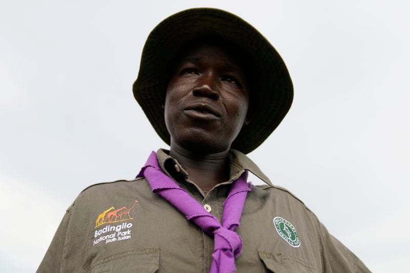 David Luwaya, an African Parks staff member, speaks during an interview with The Associated Press in Lafon village, South Sudan, Tuesday, June 18, 2024. African Parks is trying to square modernizing the country with preserving the wildlife. (AP Photo/Brian Inganga)