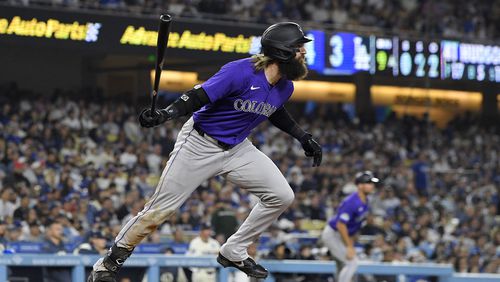 Colorado Rockies' Charlie Blackmon heads to first for a two-run home run during the ninth inning of a baseball game against the Los Angeles Dodgers, Saturday, Sept. 21, 2024, in Los Angeles. (AP Photo/Mark J. Terrill)