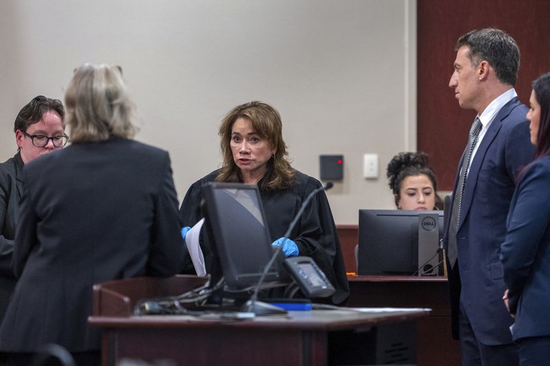 Judge Mary Marlowe Sommer, center, questions special prosecutor Kari Morrissey, second from left, about evidence not turned over to defense attorney Alex Spiro, second from right, during actor Alec Baldwin's trial for involuntary manslaughter for the 2021 fatal shooting of cinematographer Halyna Hutchins during filming of the Western movie "Rust," Friday, July 12, 2024, in Santa Fe, N.M. (Eddie Moore/The Albuquerque Journal via AP, Pool)