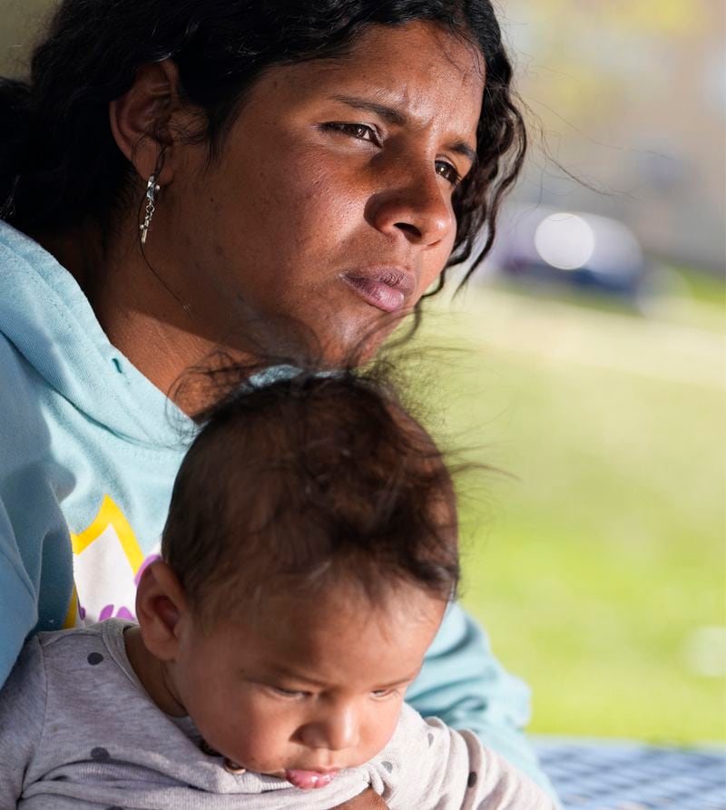 Ivanni Herrera holds her baby Milan Guzman during an interview in a park Friday, May 18, 2024, in Aurora, Colorado. (AP Photo/Jack Dempsey)