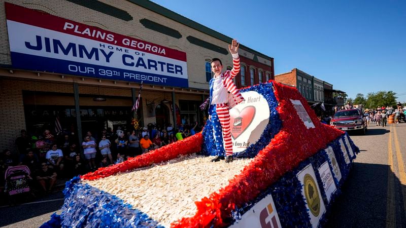 A float moves down main street during the 26th annual Plains Peanut Festival, ahead of former President Jimmy Carter's birthday on Oct. 1, Saturday, Sept. 28, 2024, in Plains, Ga. Carter didn't attend the festival. (AP Photo/Mike Stewart)