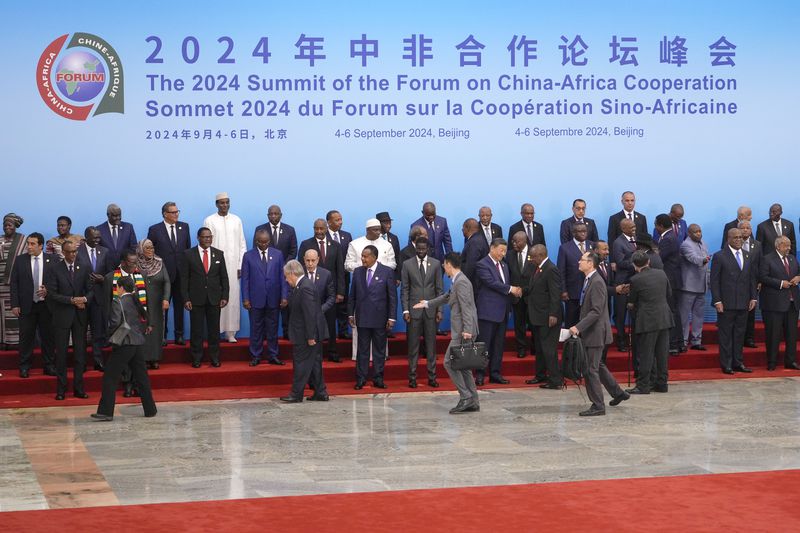 China's President Xi Jinping, center right, shakes hands with leaders from African countries as they arrive for a group photo session before the opening ceremony of the China Africa Forum at the Great Hall of the People in Beijing, Thursday, Sept. 5, 2024. (AP Photo/Andy Wong, Pool)