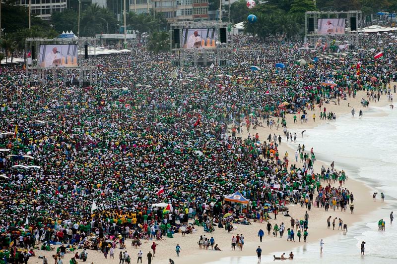 FILE - Crowds attend the World Youth Day's closing Mass line the shore of Copacabana beach in Rio de Janeiro, on July 28, 2013. An estimated 3 million people poured onto the beach for the final Mass of Pope Francis' historic trip to his home continent, cheering the first Latin American pope in one of the biggest turnouts for a papal Mass in recent history. (AP Photo/Domenico Stinellis, File)