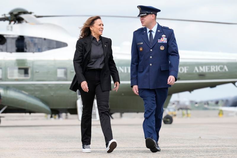 Democratic presidential nominee Vice President Kamala Harris, escorted by U.S. Air Force, Director of Flightline Protocol, Maj. Philippe Caraghiaur, walks to board Air Force Two, to travel to Pennsylvania for campaign events, Friday, Sept. 13, 2024, at Joint Base Andrews, Md. (AP Photo/Jacquelyn Martin)